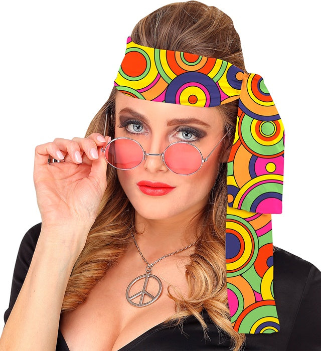 Gelbes Stirnband mit 70er-Jahre Kreisen als Retro-Accessoire