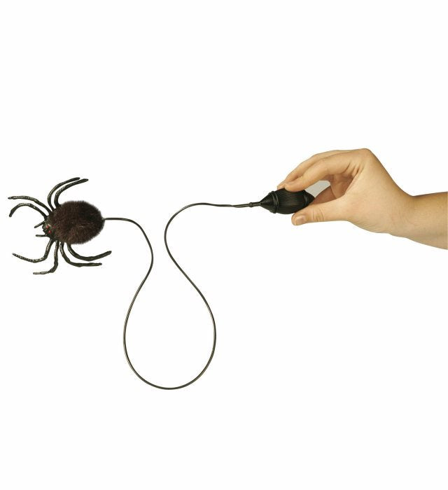 Springende Spinne als lustiges Party-Gadget auf hellem Untergrund