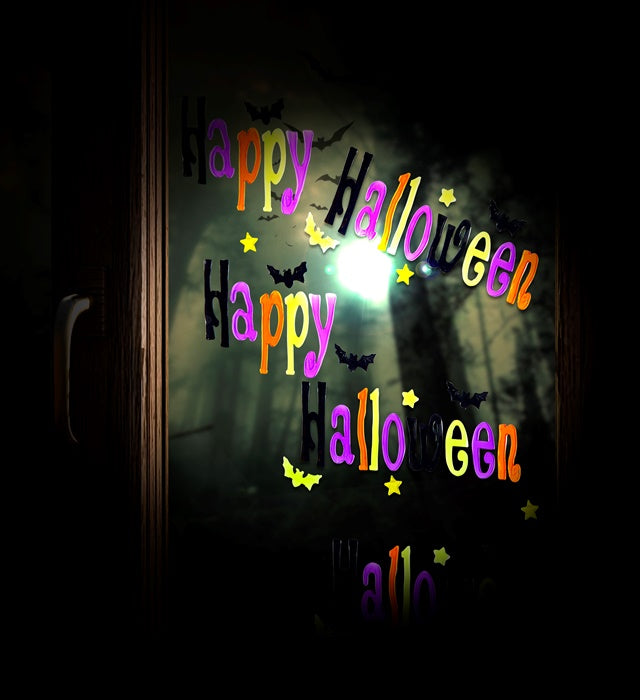 Fröhliche Halloween Fensterbilder mit bunten Motiven in 50x15 cm Größe an einem Fenster