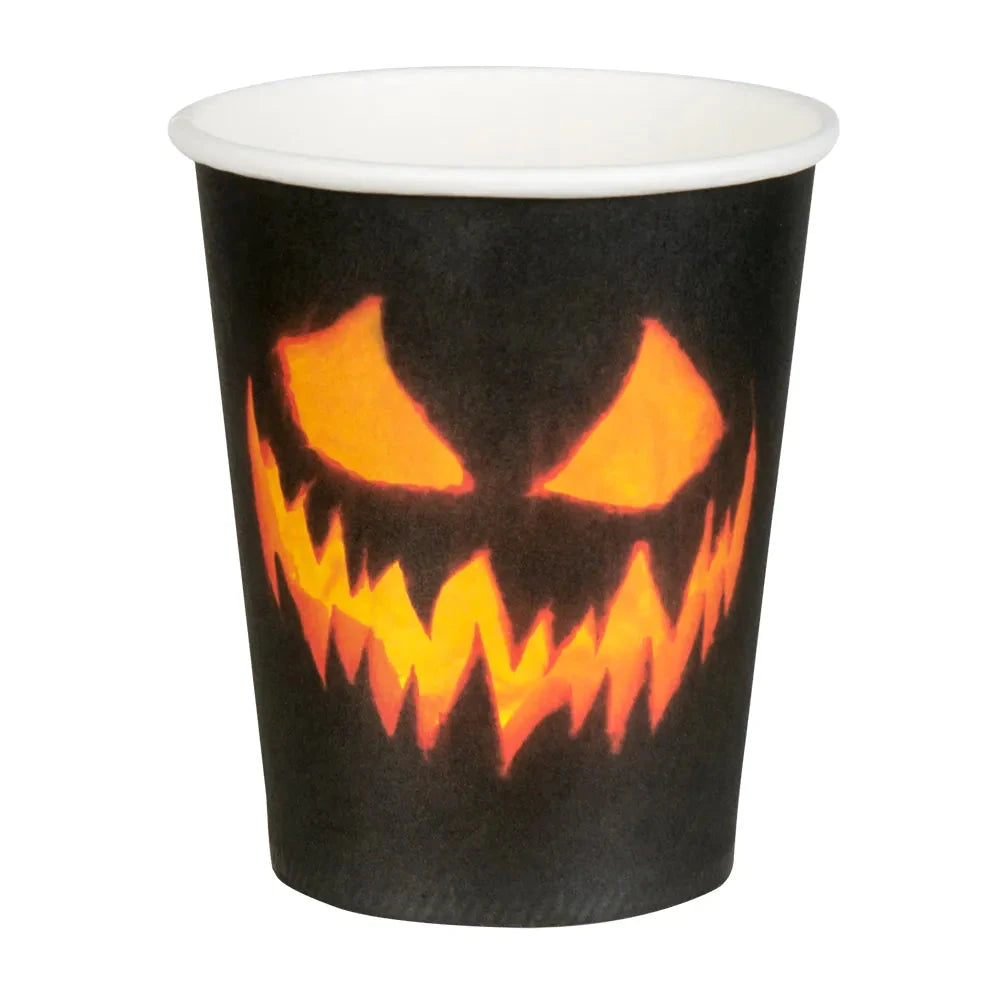 Black paper cup with orange jack-o'-lantern face for Halloween.