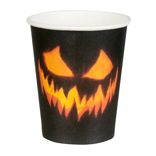 Black paper cup with orange jack-o'-lantern face for Halloween.