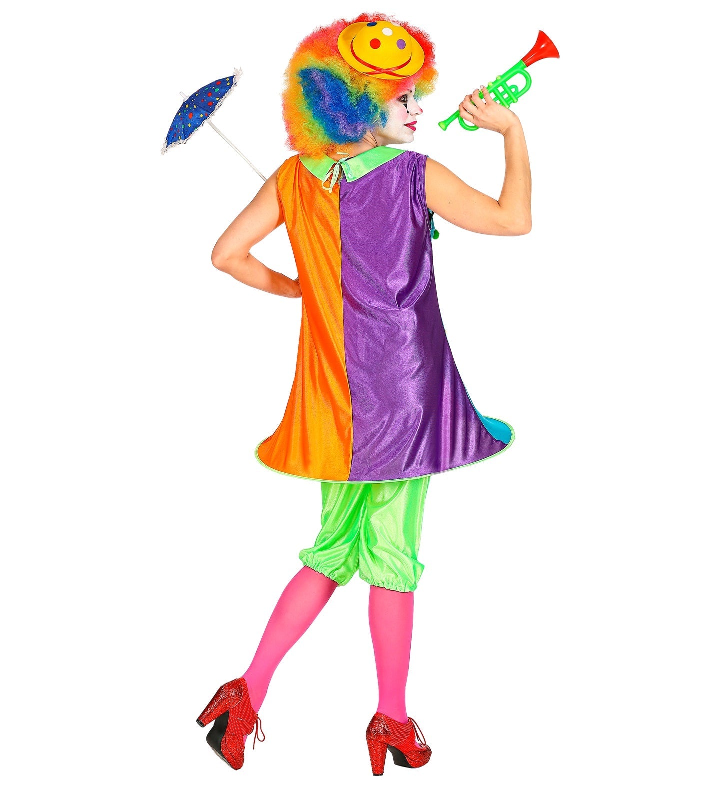 Woman in colorful clown costume with dress, hoop skirt, trousers, wig, horn, and umbrella.