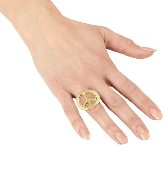 Gold peace sign ring on a woman's hand, 18K gold plated hippie style.
