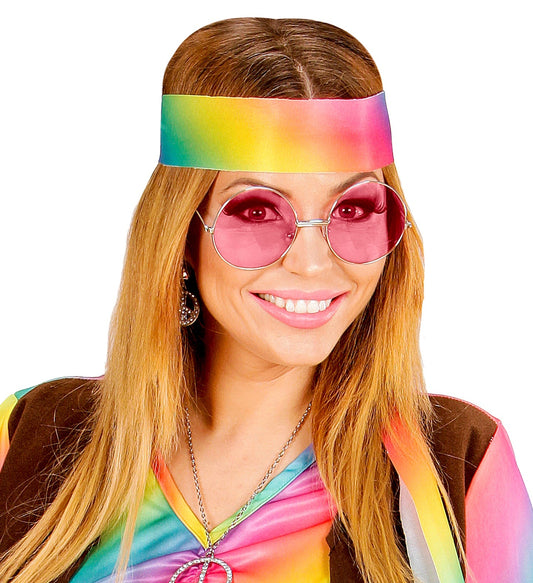 Pink tinted hippie glasses with round frames on a model with headband.
