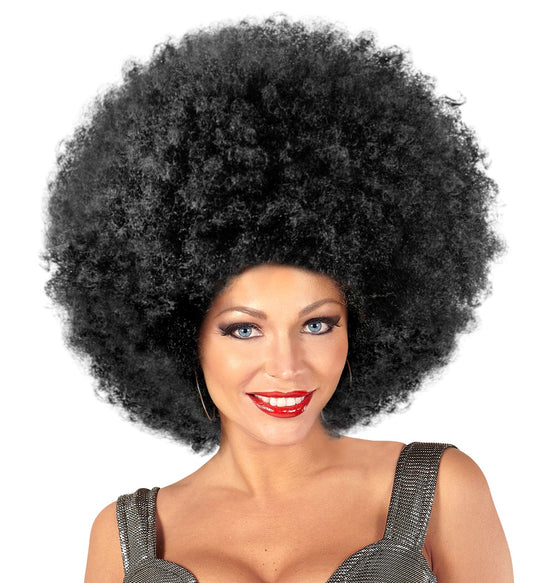 Woman wearing a voluminous black synthetic maxi afro wig with tight curls.