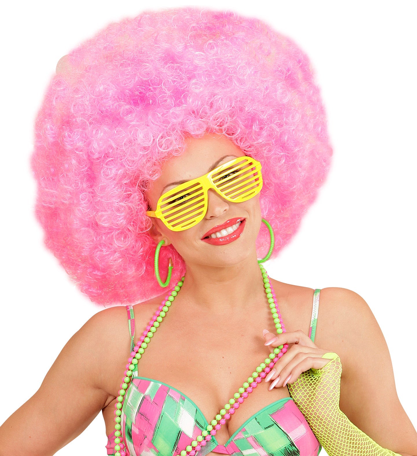 Woman wearing large pink afro wig, yellow slitted sunglasses, green hoop earrings, necklace, and checkered swimsuit.