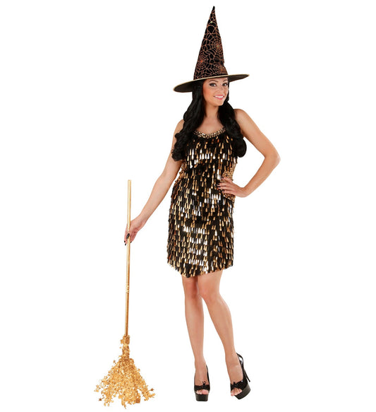 Woman modeling black sequin party dress with gold accents and elegant evening style.