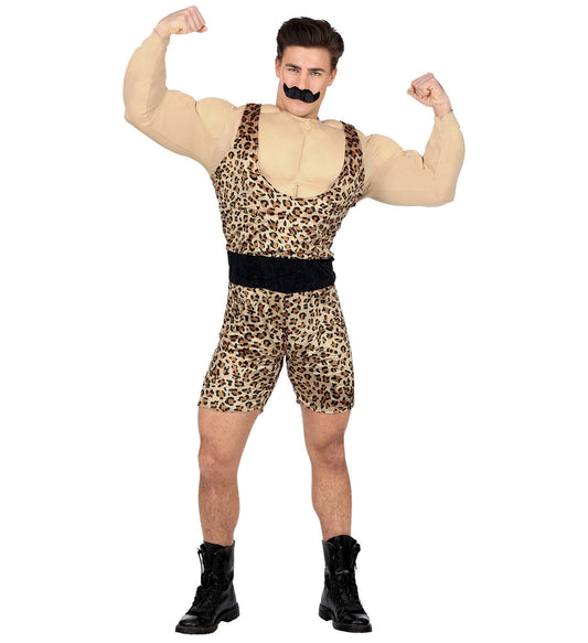 Man in leopard-print strongman costume with muscle shirt, belt, mustache, and boots.