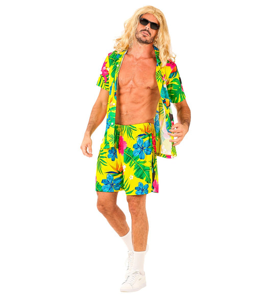 Man in blond wig wearing yellow floral Hawaiian shirt and shorts set.