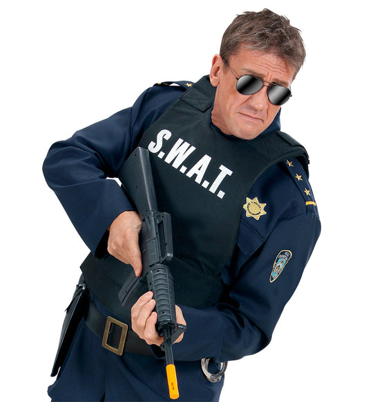 Man in SWAT tactical vest with Oxford fabric, adjustable straps, and police insignia.