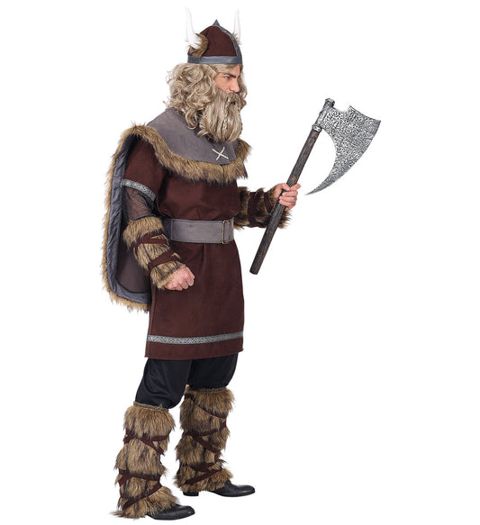 Man in Widmann Viking costume with tunic, pants, belt, horned helmet and fur leg wraps holding an axe.