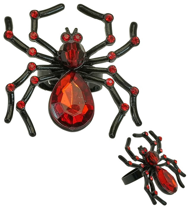 Spinnenring mit rotem Strass-Edelstein auf schwarzem Hintergrund