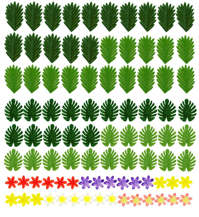 Hawaiianisches Tischdeko Set mit bunten Blättern und Blumen auf einem gedeckten Tisch