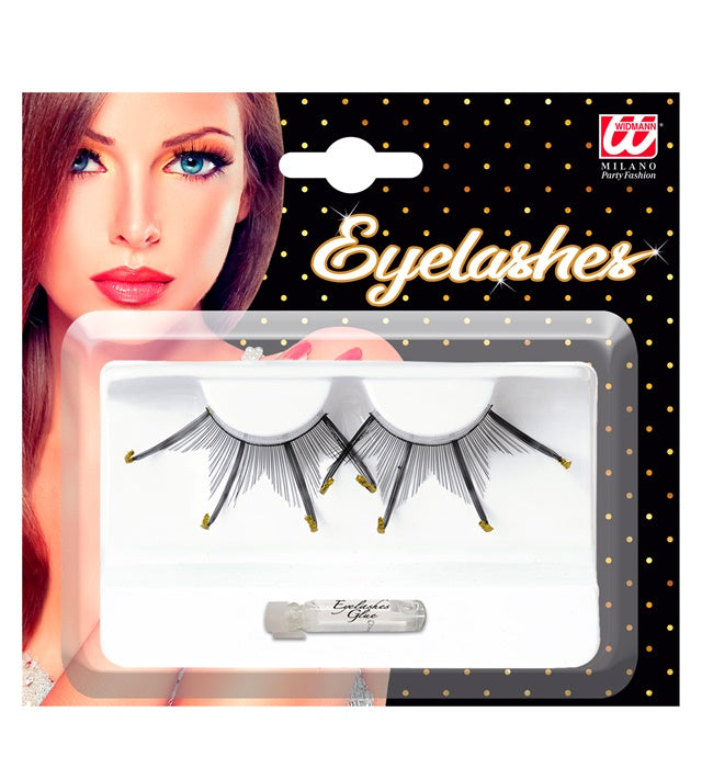 Schwarze lange Wimpern mit goldfarbenem Rand und Klebstofftube