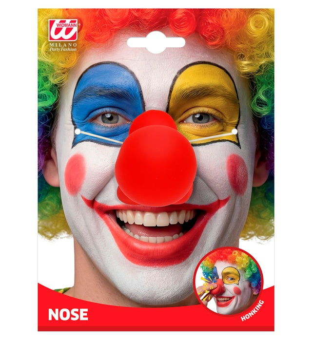 Rote Clownnase mit integriertem Soundeffekt auf weißem Hintergrund