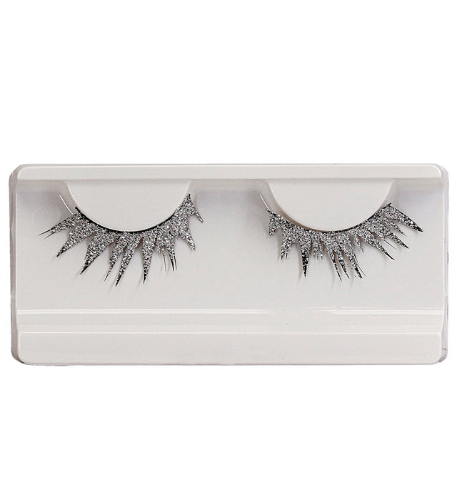 Silberne künstliche Wimpern mit Kleber in Glasflasche in einer Box