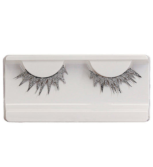 Silberne künstliche Wimpern mit Kleber in Glasflasche in einer Box