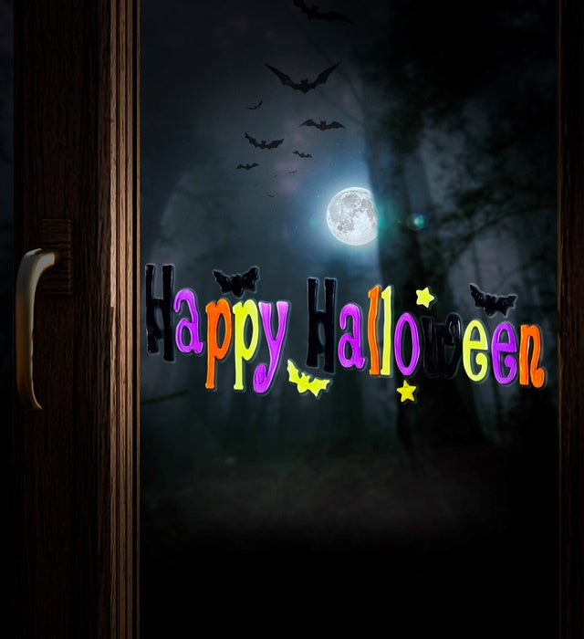 Fröhliche Halloween Fensterbilder mit bunten Motiven in 50x15 cm Größe an einem Fenster
