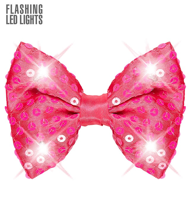 Pink glitzernde Paillettenfliege mit 4 LED-Lichtern auf schwarzem Hintergrund