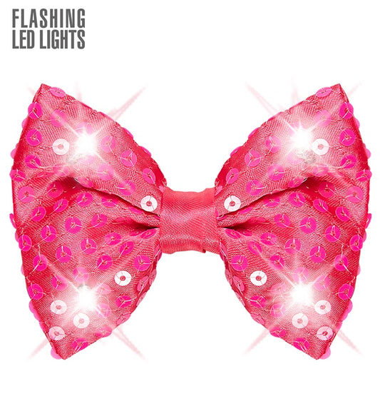 Pink glitzernde Paillettenfliege mit 4 LED-Lichtern auf schwarzem Hintergrund