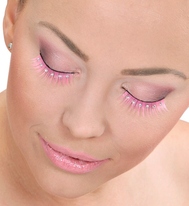 Spitze rosa Wimpern mit funkelnden Strasssteinen und Klebstoff in Glasflasche