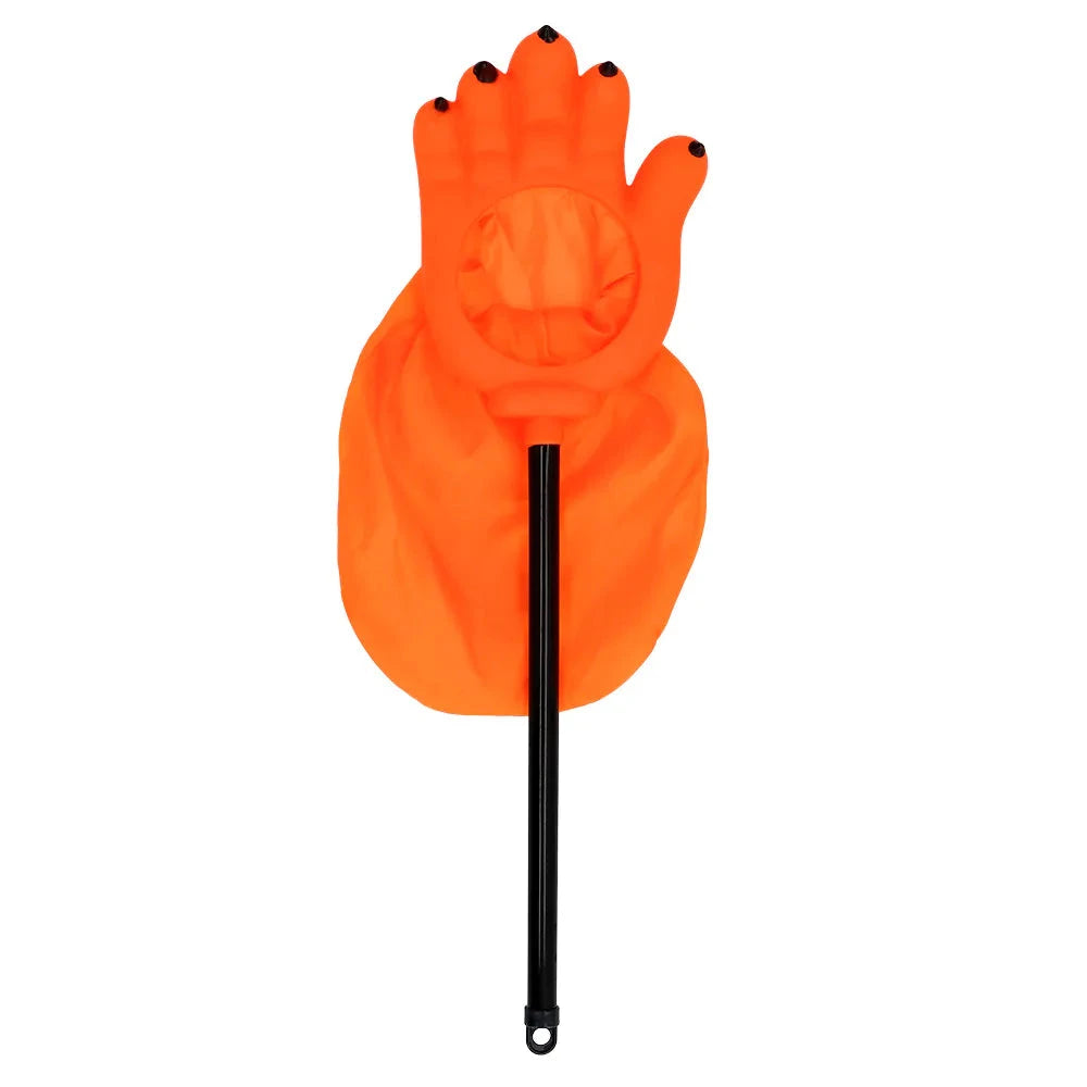 Orange pumpkin-shaped trick-or-treat bag with grinning face and wooden handle, 26 cm.