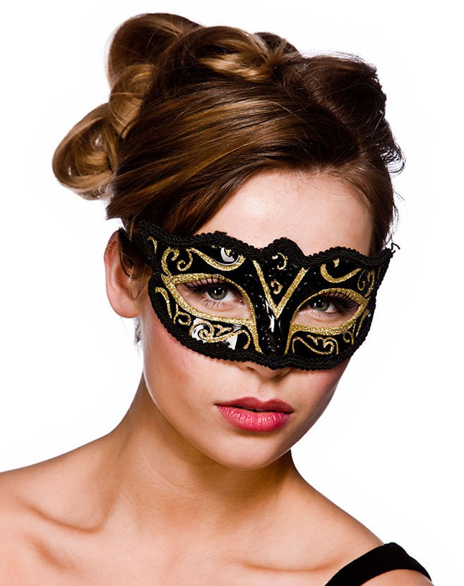 Black and gold Verona masquerade eye mask with intricate filigree on a model.