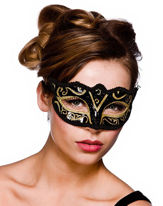 Black and gold Verona masquerade eye mask with intricate filigree on a model.