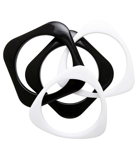 Vier schwarze und weiße Disko-Armbänder im Set für Party und Festival.