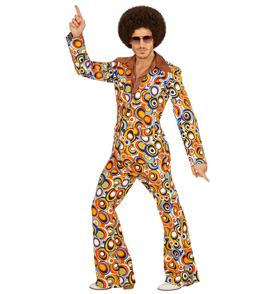 Man in 70s disco suit with bubble pattern, flared trousers, and one finger pointing up.