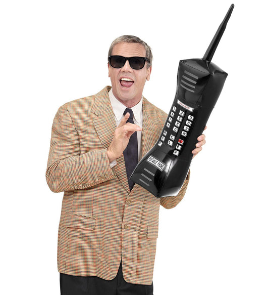 Inflatable giant mobile phone prop, 77cm tall, held by a smiling man in suit and sunglasses.