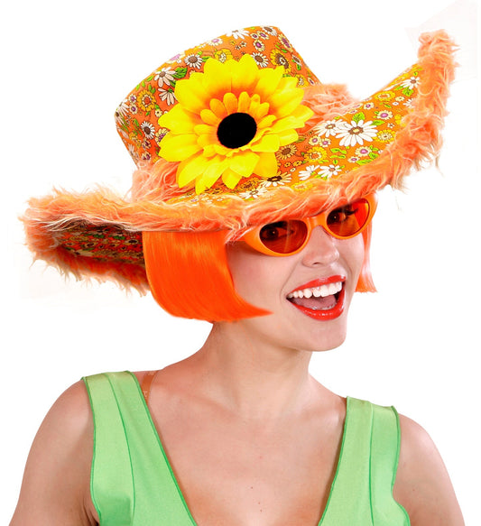 Orange hippie hat with plush trim and large sunflower on a model with red bob haircut.