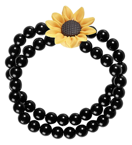 Black beaded bracelet with a yellow sunflower charm.