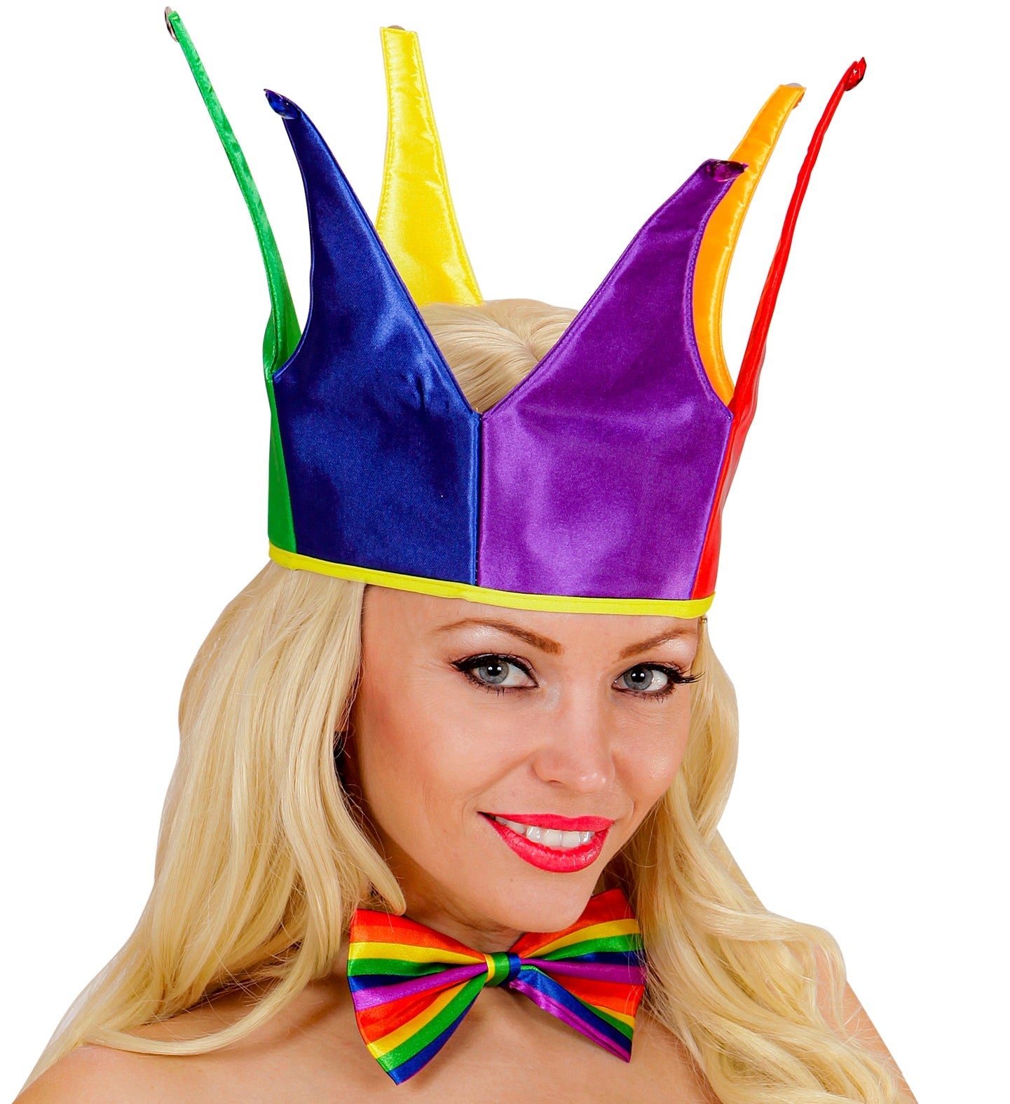 Blonde woman smiling while wearing a neon rainbow bow tie and multicolored jester hat.