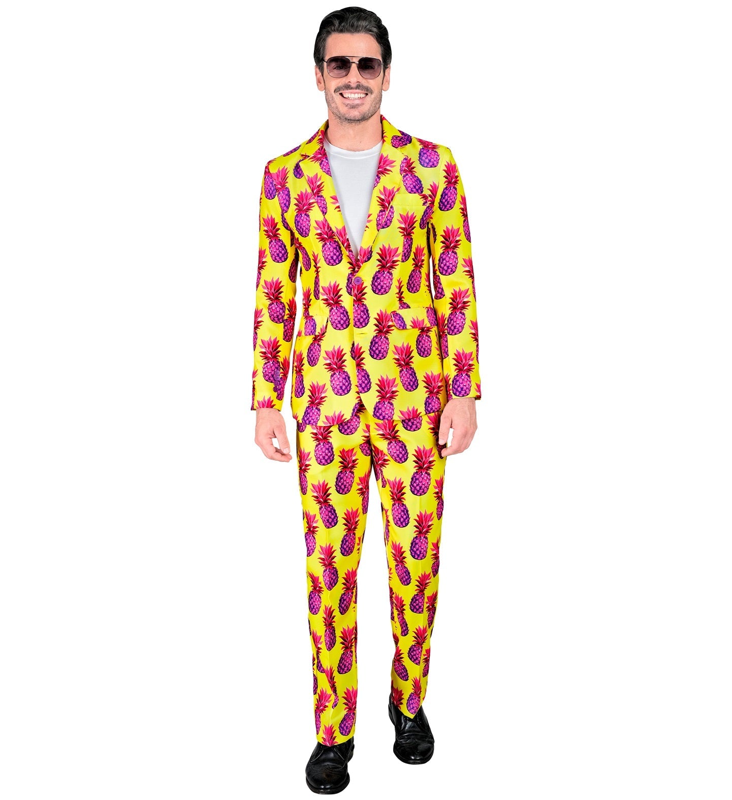 Man in neon yellow pineapple-print suit with white shirt and sunglasses.