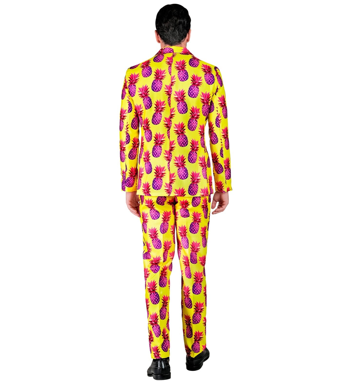 Rear view of men's yellow suit with pink pineapple print, model walking away.