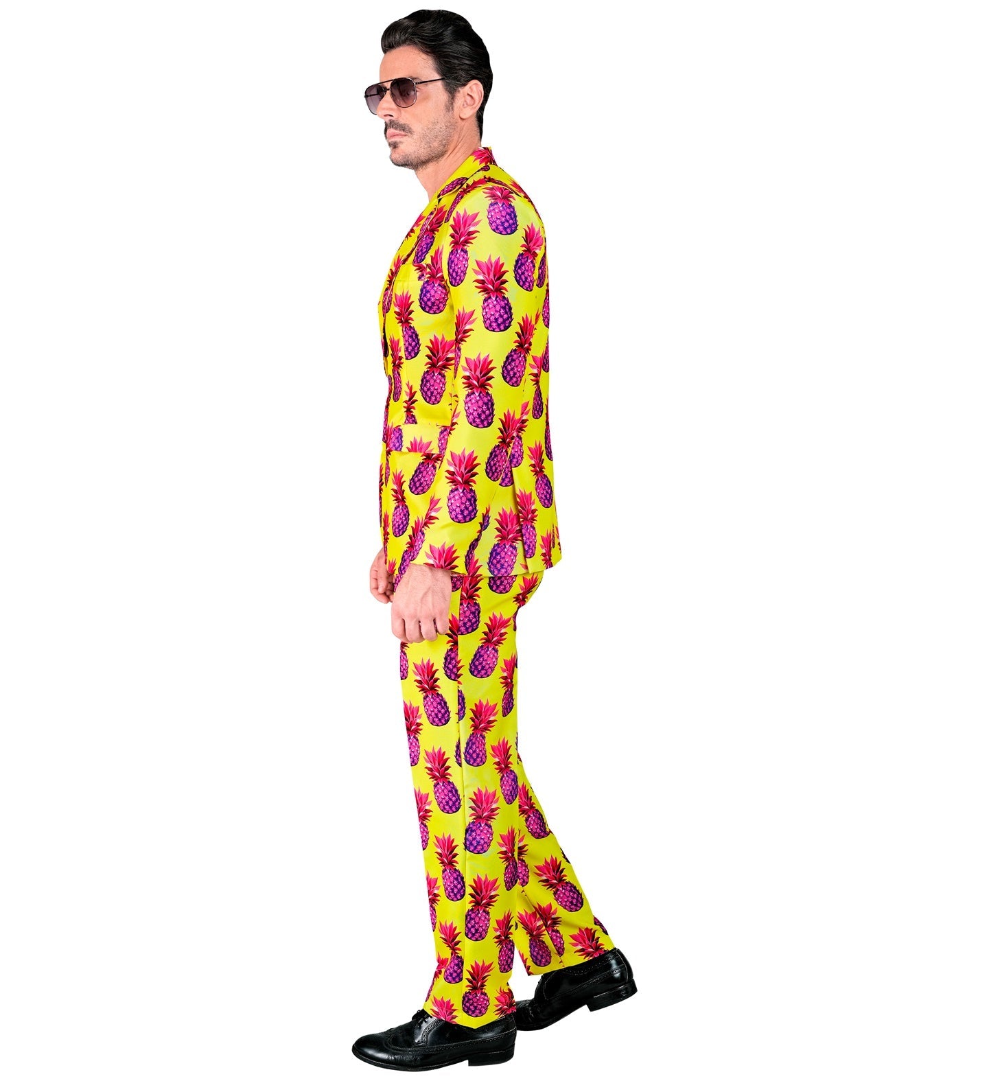 Man in yellow neon pineapple print suit, side profile view.