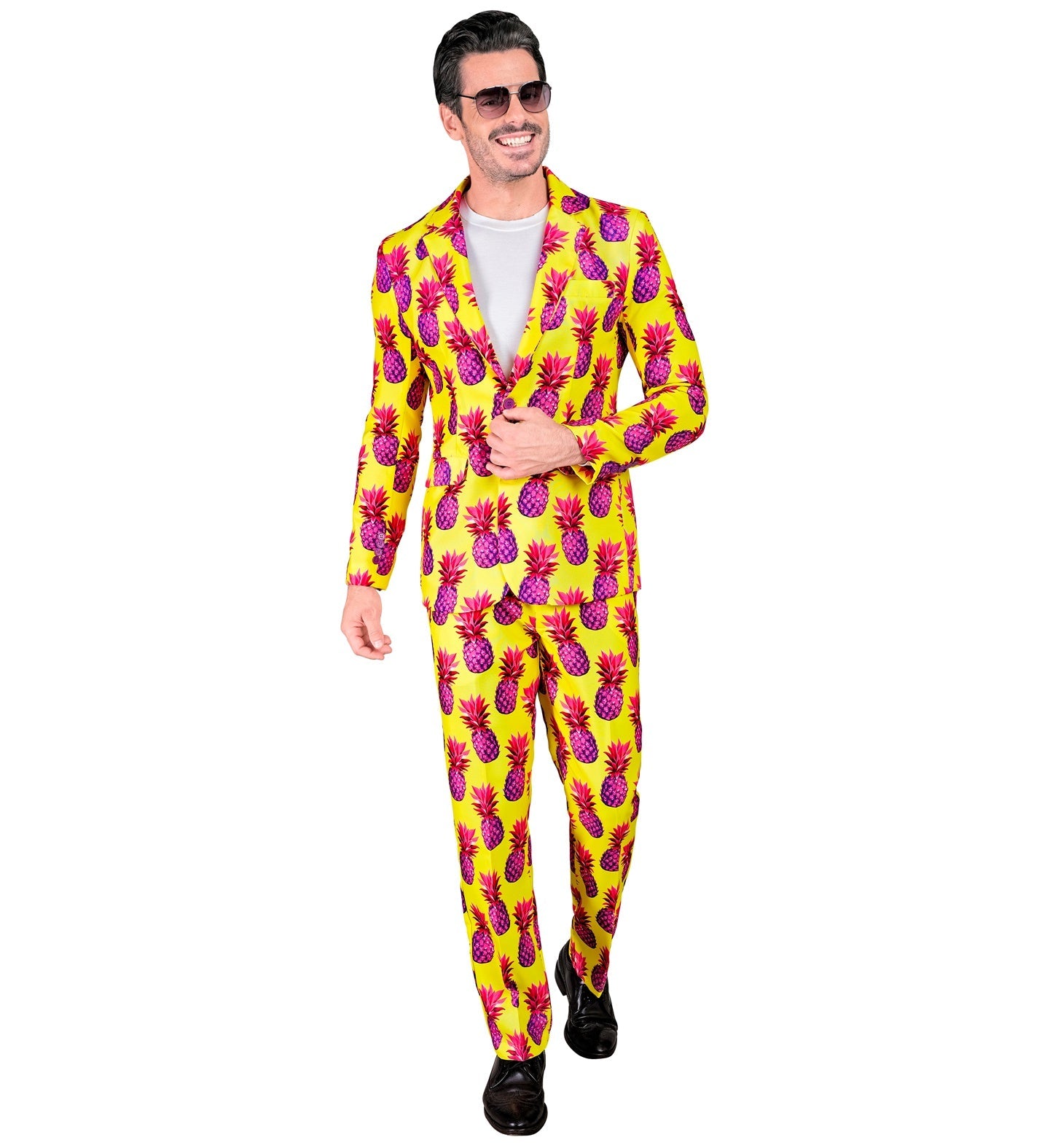 Man in neon yellow pineapple print suit with white shirt and sunglasses.