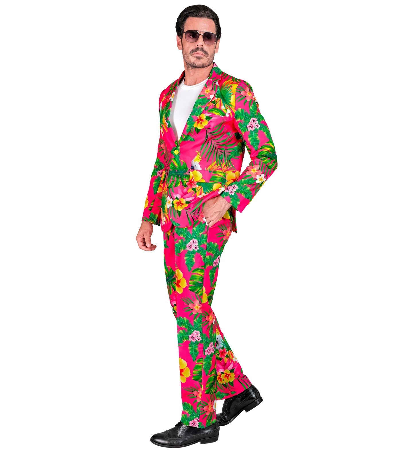 Man in neon floral Hawaiian suit with pink and green tropical print, white shirt, and black shoes.