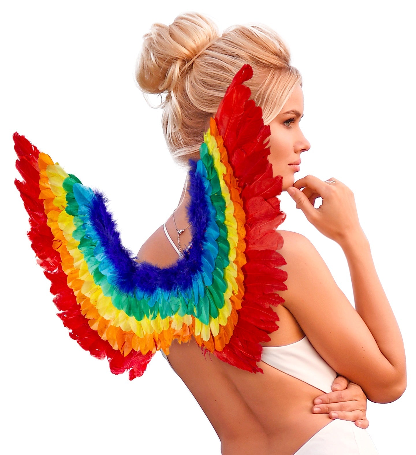 Blonde woman wearing UV-reactive rainbow neon feather wings with elastic straps.