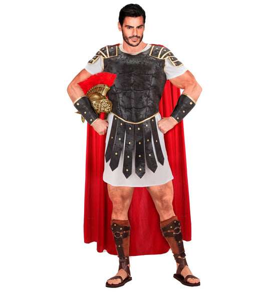 Man in Roman centurion costume with black armor tunic, red cape, gold bracers, and sandals.