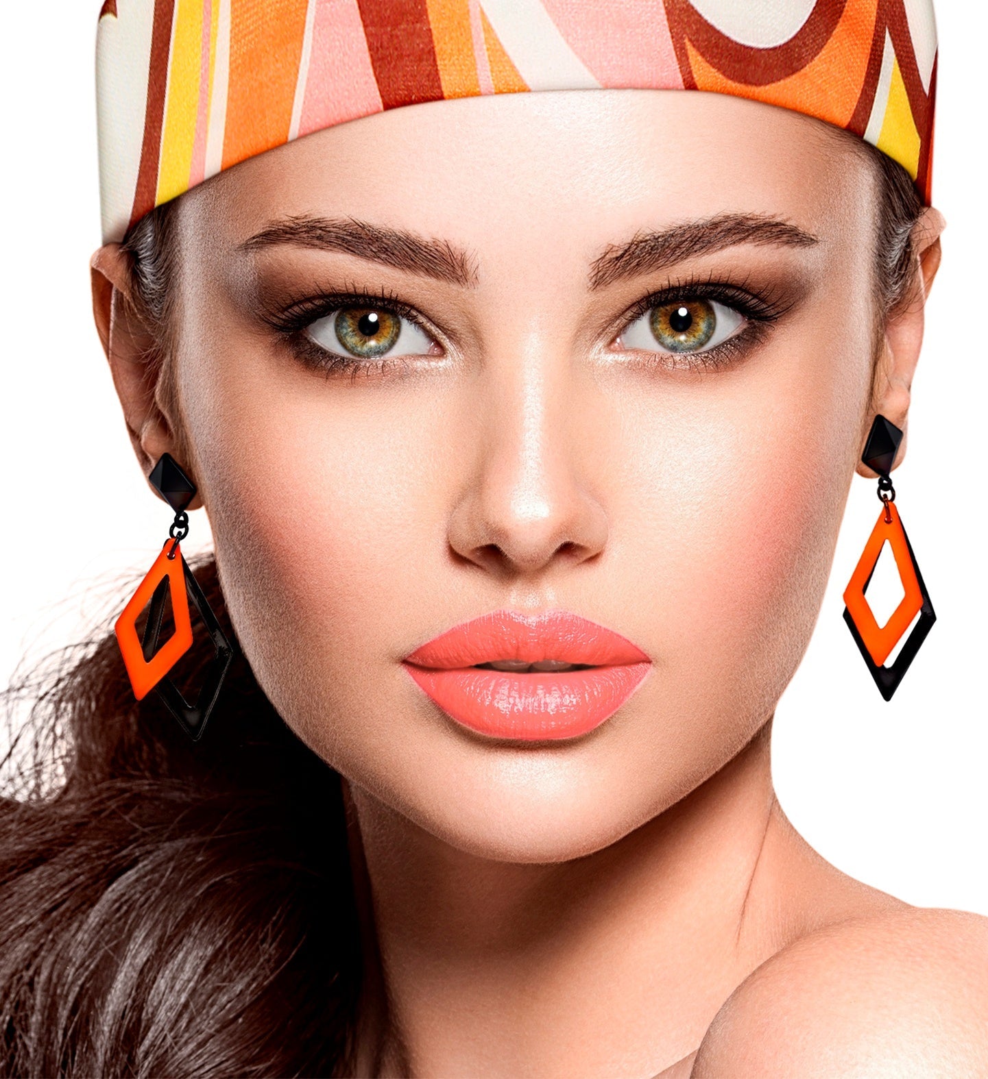 Black and neon orange acrylic rhombus earrings on a model with headscarf.