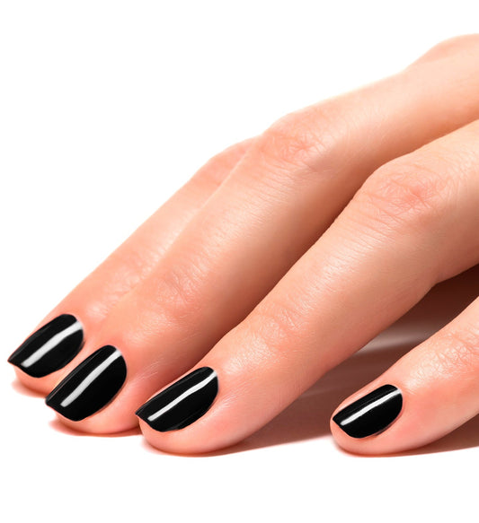 Close-up of fingers with glossy black peel-off nail polish applied.
