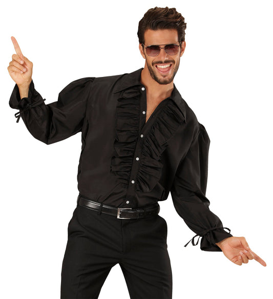 Man in black ruffled shirt with puffed sleeves and frilled collar, posing dynamically.