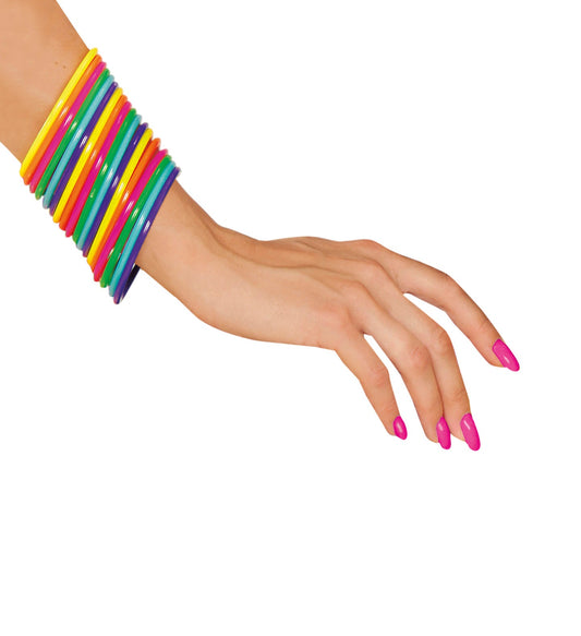 A woman's arm wearing a stack of 18 colorful neon plastic bangles in yellow, green, orange, and pink.