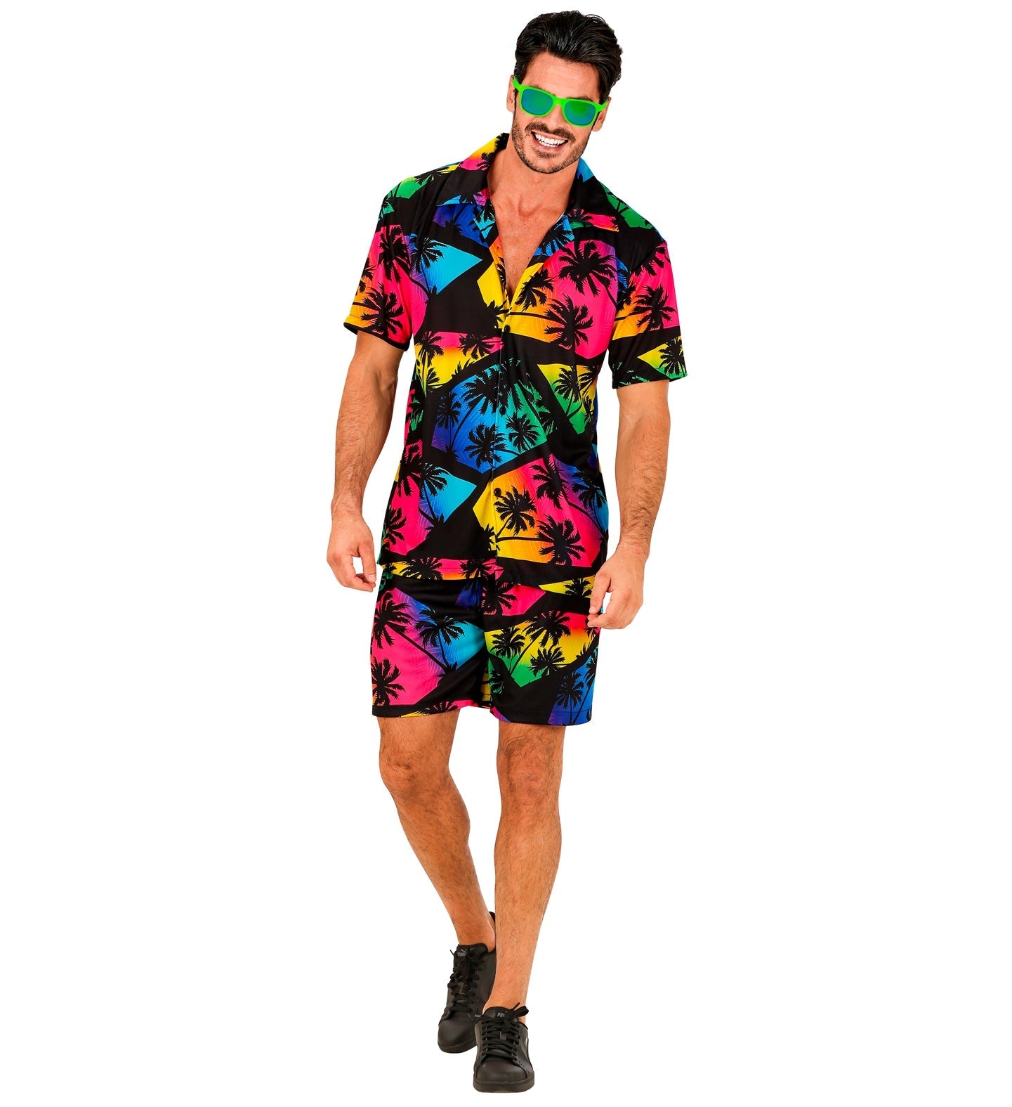 Man in dark tropical print shirt and shorts with neon palm accents and green sunglasses.