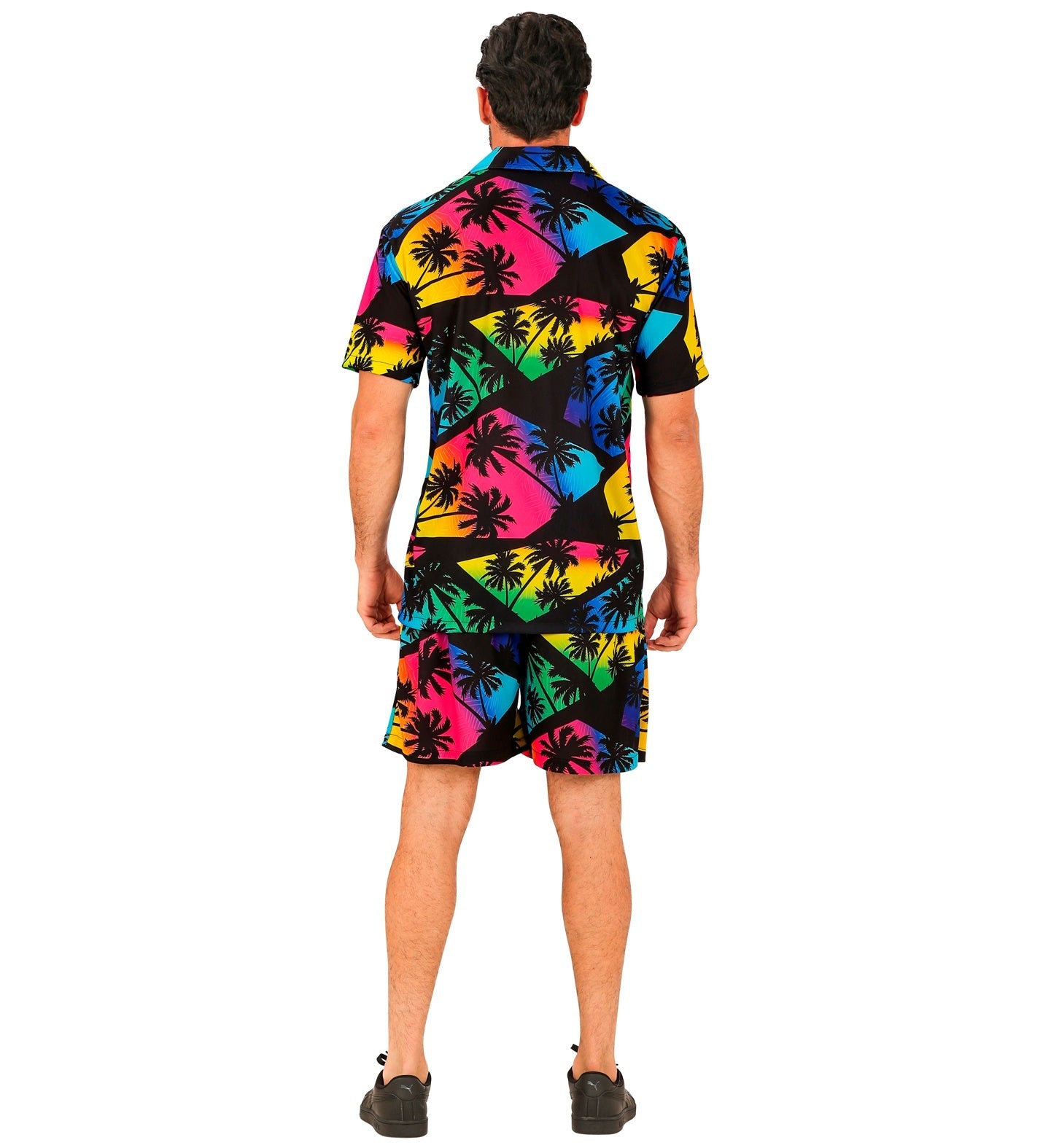 Rear view of man wearing Widmann Hawaii outfit set with dark tropical palm print shirt and shorts featuring neon accents.