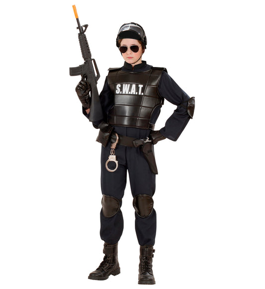Child in black SWAT costume with tactical vest, toy rifle, mask, and pads.