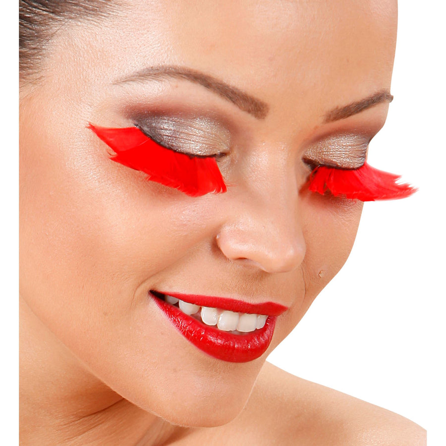 "WIMPERN AUS ROTEN FEDERN" in Box mit Klebstoff in Glassflasche – Detailansicht